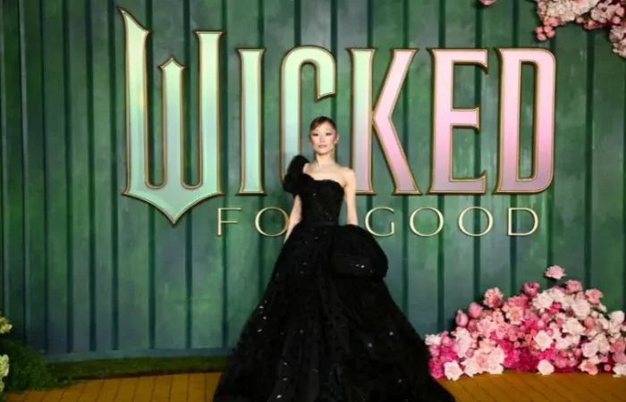 An Australian man faces charges in Singapore after approaching Ariana Grande at a movie premiere.