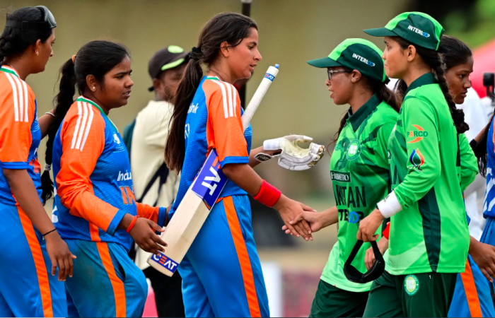 Blind women cricketers from India and Pakistan demonstrate the spirit of the game through handshakes.